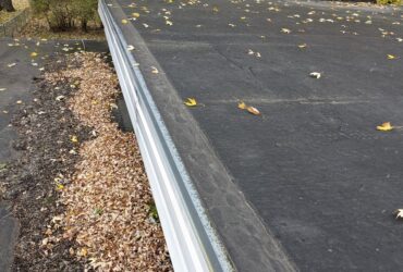 What does hail damage look like on a flat roof