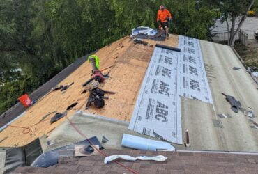 Roofing accessories facts Synthetic roofing underlayment being laid over the roof sheathing before installing roofing materials