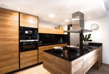 a brown wooden kitchen in a recently renovated home