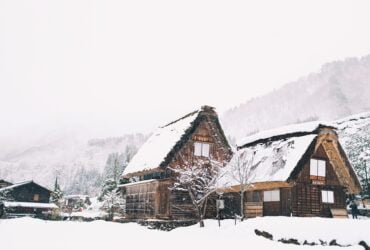 A home under a harmless layer of snow, disproving one of the winter roofing myths