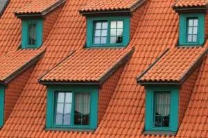 How to Select the Best Roofing Material for High Winds and Hurricanes 3 Roof with green windows.