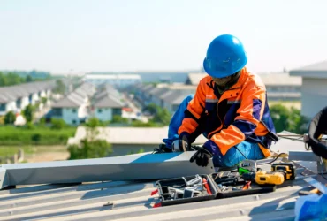 What to Look for a Roofing Contractor in St Paul, MN - A Commercial Roofer Working on a Roof in Minneapolis