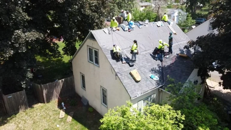 Sellers Roofing crew in high-visibility vests working on a residential roof