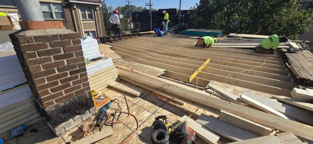 Commercial Roofing Company Saint Paul, MN Workers installing roof materials.