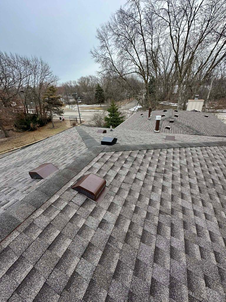 Completed architectural asphalt shingle roof replacement on a residential home in the Saint Paul Twin Cities metro by Sellers Roofing — Roofers Local 96 union crew installation