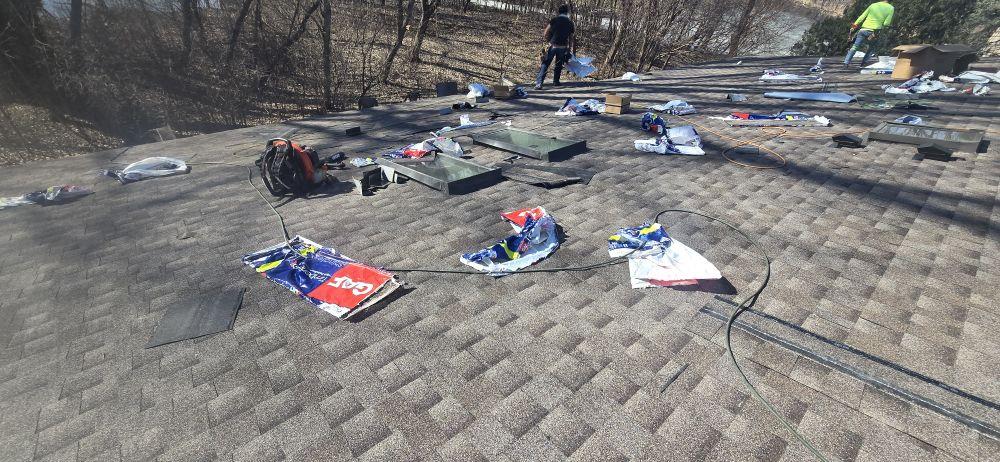 Sellers Roofing crew installing GAF asphalt shingles on a residential home in the Twin Cities metro — GAF-certified union installation