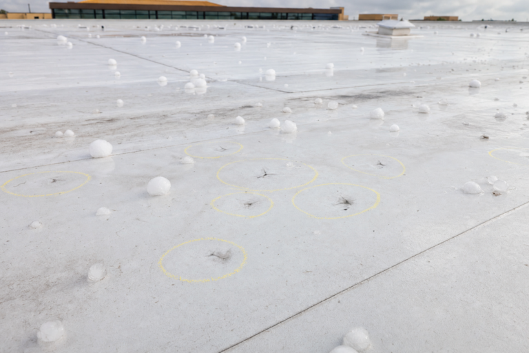 Hail damage on commercial TPO membrane in Maplewood MN with adjuster chalk circles