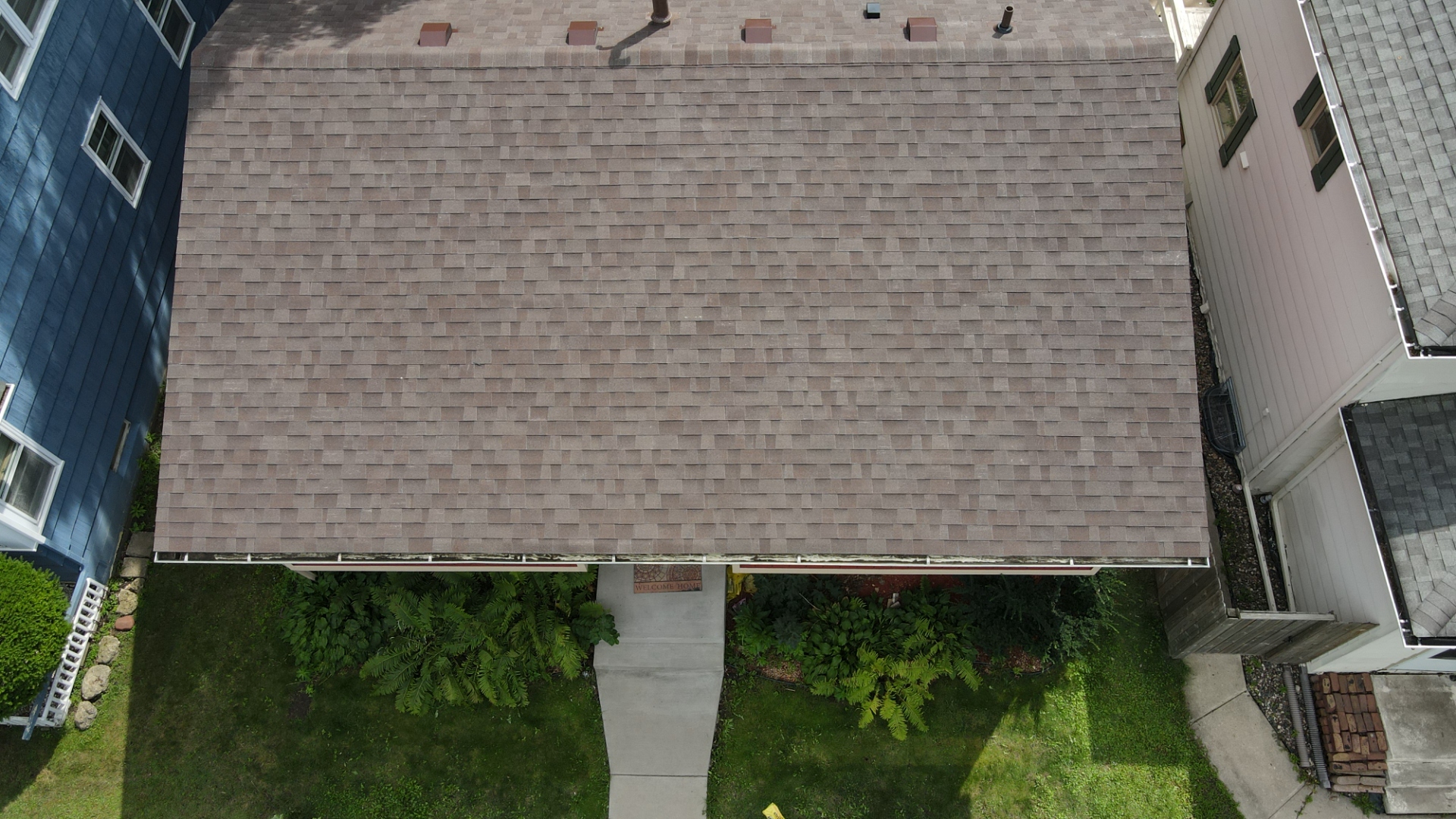Sellers Roofing Company aerial view of full roof tear-off in progress on a Minnesota home — historic district roofing project in Stillwater, Washington County