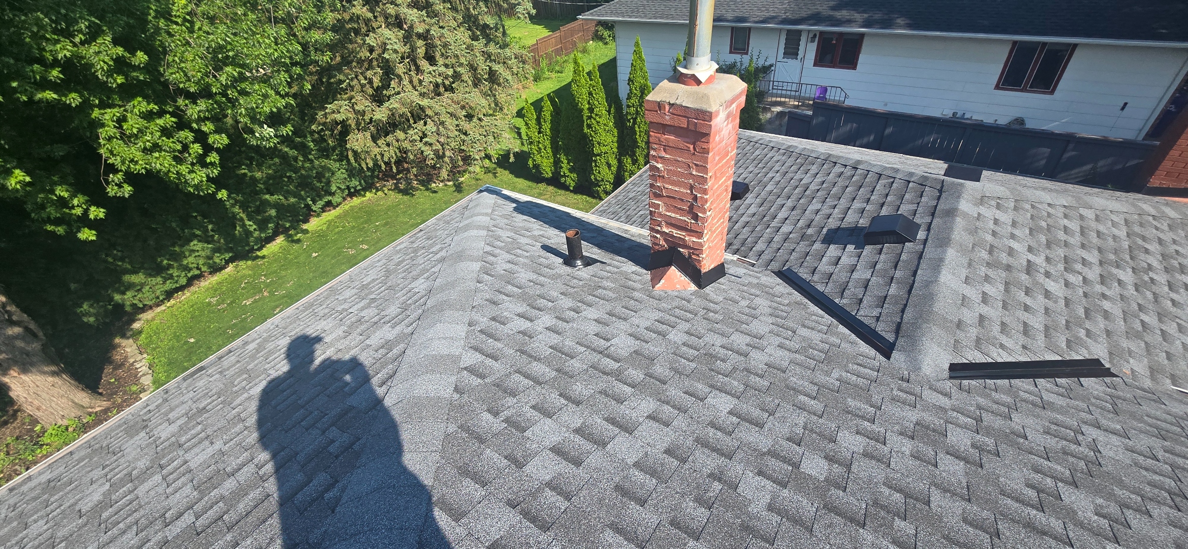 Sellers Roofing Company crew performing commercial flat roof repair on a Shoreview, MN business park building