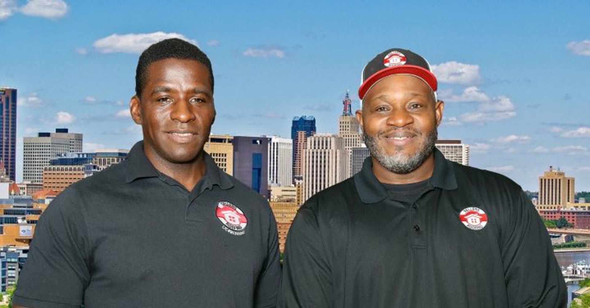 Ted Sellers (left), Founder and Co-Owner, and Keith Dawson (right), Co-Owner and Operations Manager, of Sellers Roofing Company in front of the Saint Paul skyline — a Black-owned, MBE/DBE certified union roofing contractor serving the Twin Cities metro