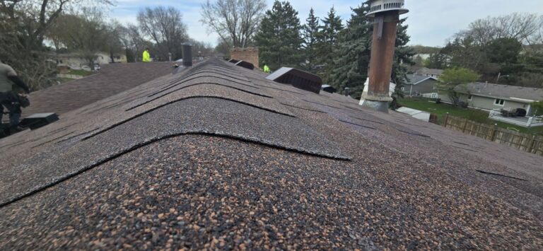 Worn asphalt shingle ridge documented during a Sellers Roofing inspection before roof replacement in New Brighton, MN