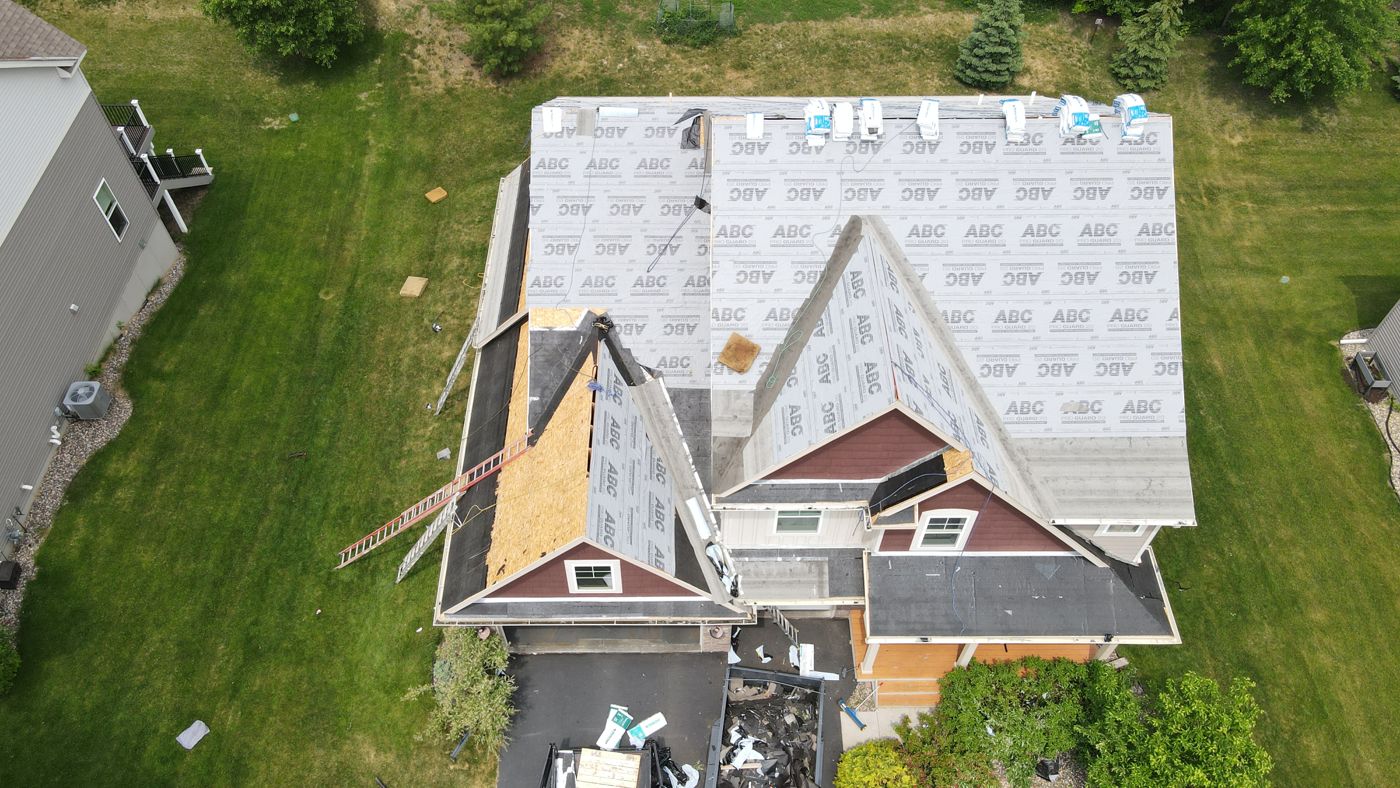 Commercial & Residential Roofing in Saint Paul, MN | Sellers Roofing Drone view of residential roof tear-off and synthetic underlayment installation by Sellers Roofing in Eden Prairie, MN