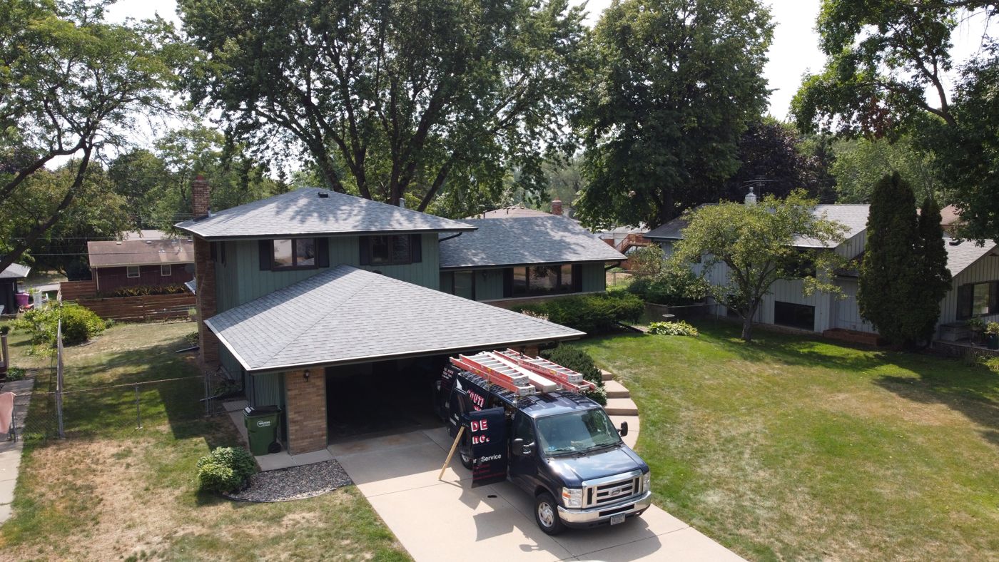 Commercial & Residential Roofing in Saint Paul, MN | Sellers Roofing Aerial view of Sellers Roofing union crew installing architectural shingles on a home in Roseville, MN